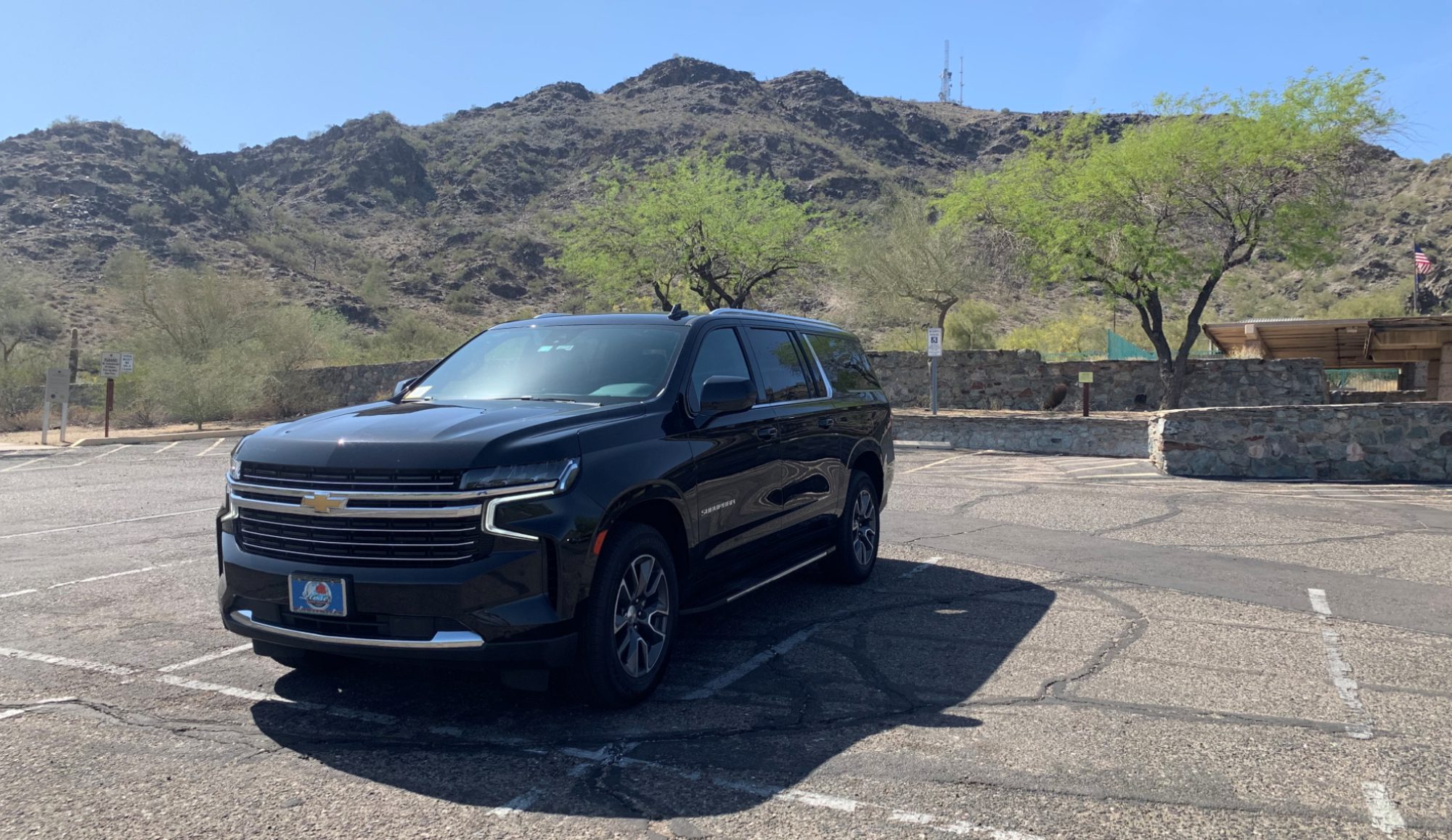 A black suv parked in the parking lot.