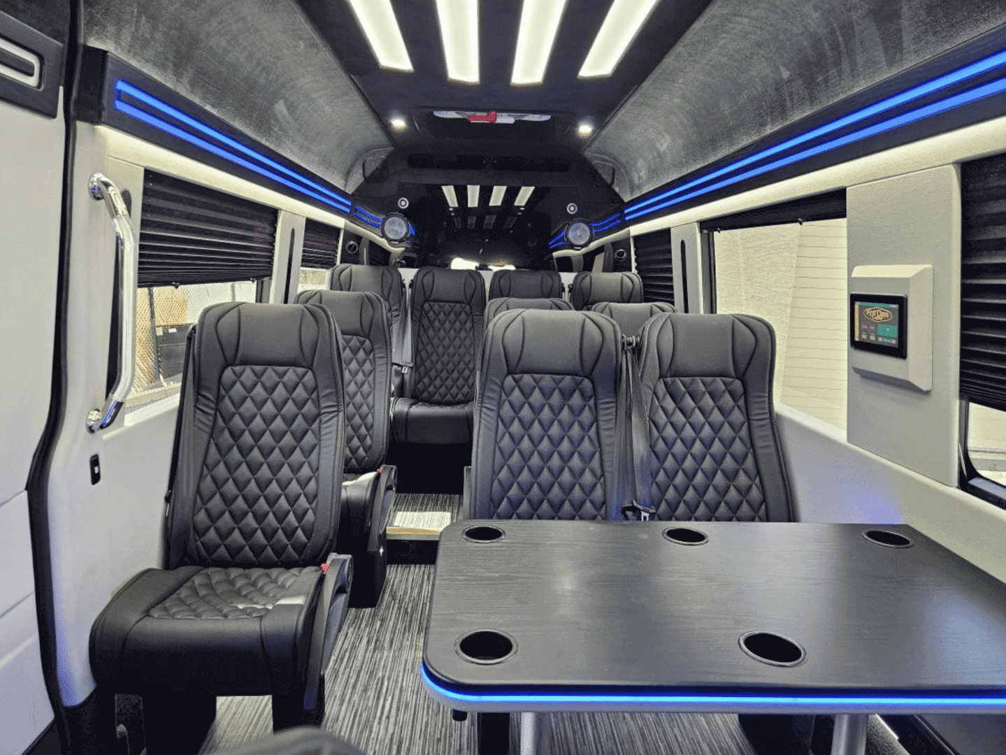 A bus with many seats and tables in it