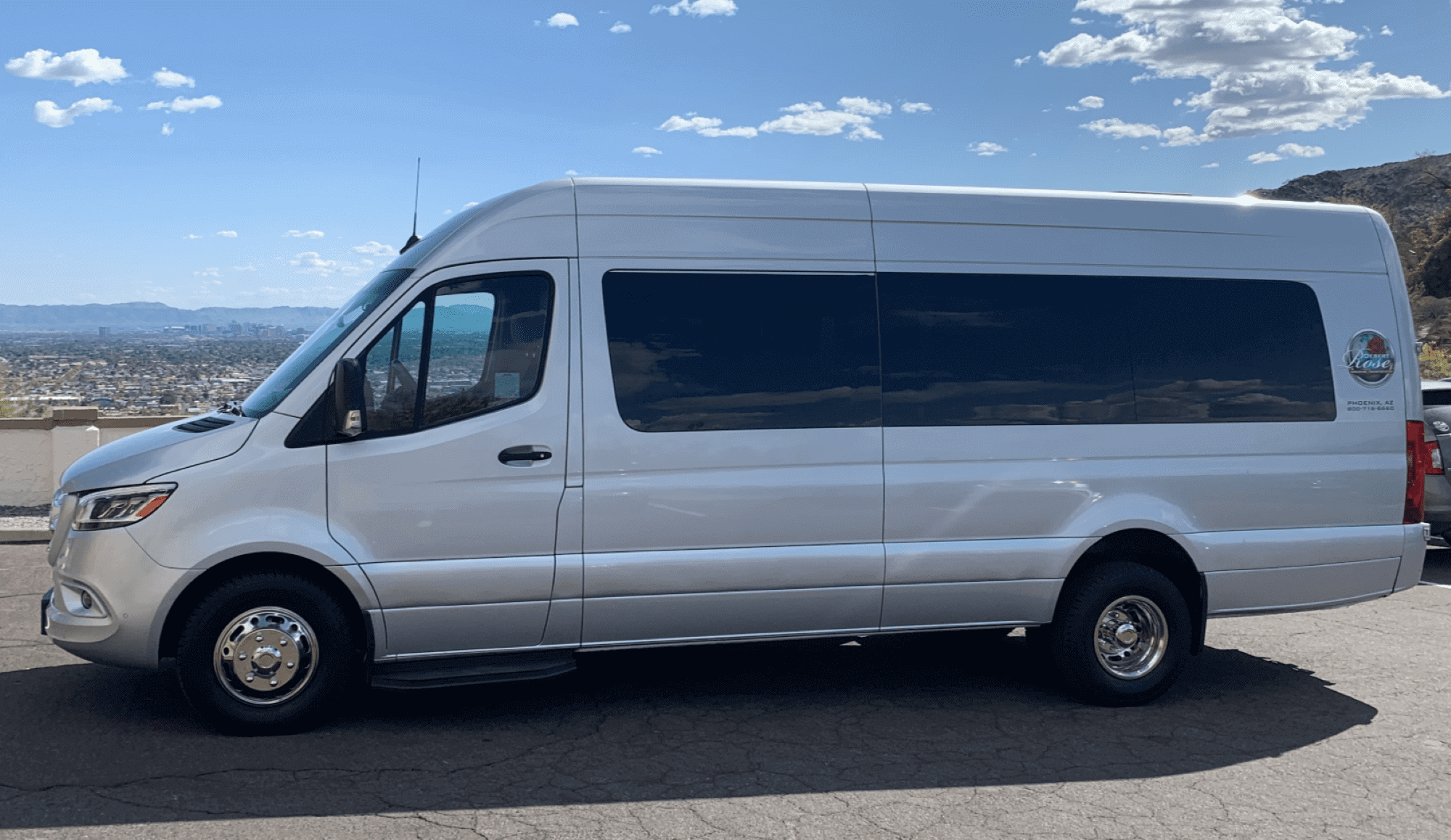 A white van is parked on the side of the road.