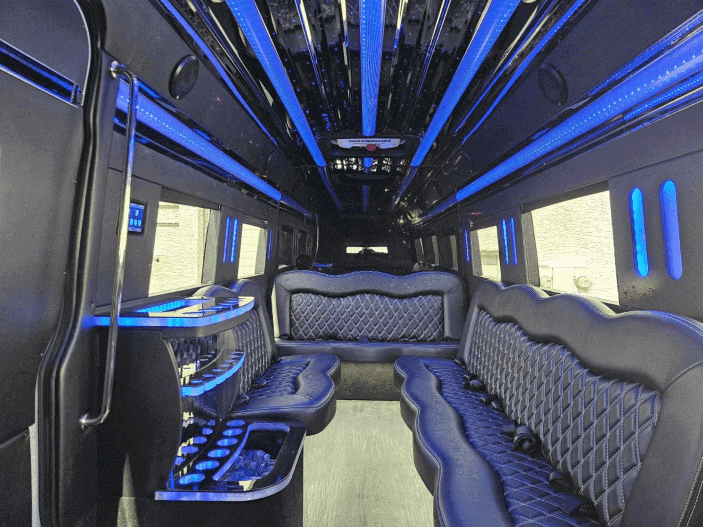 A bus with blue lights and seats in it